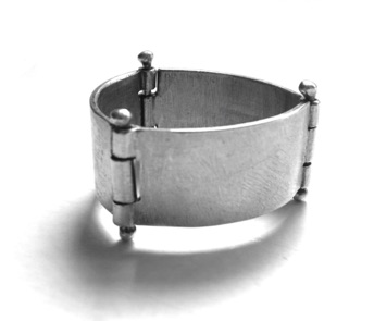 HINGE $125-sterling silver ring with sanding disk texture (3/8" wide band) made to size specifications
HINGE $125-sterling silver ring with sanding disk texture (3/8" wide band) made to size specifications